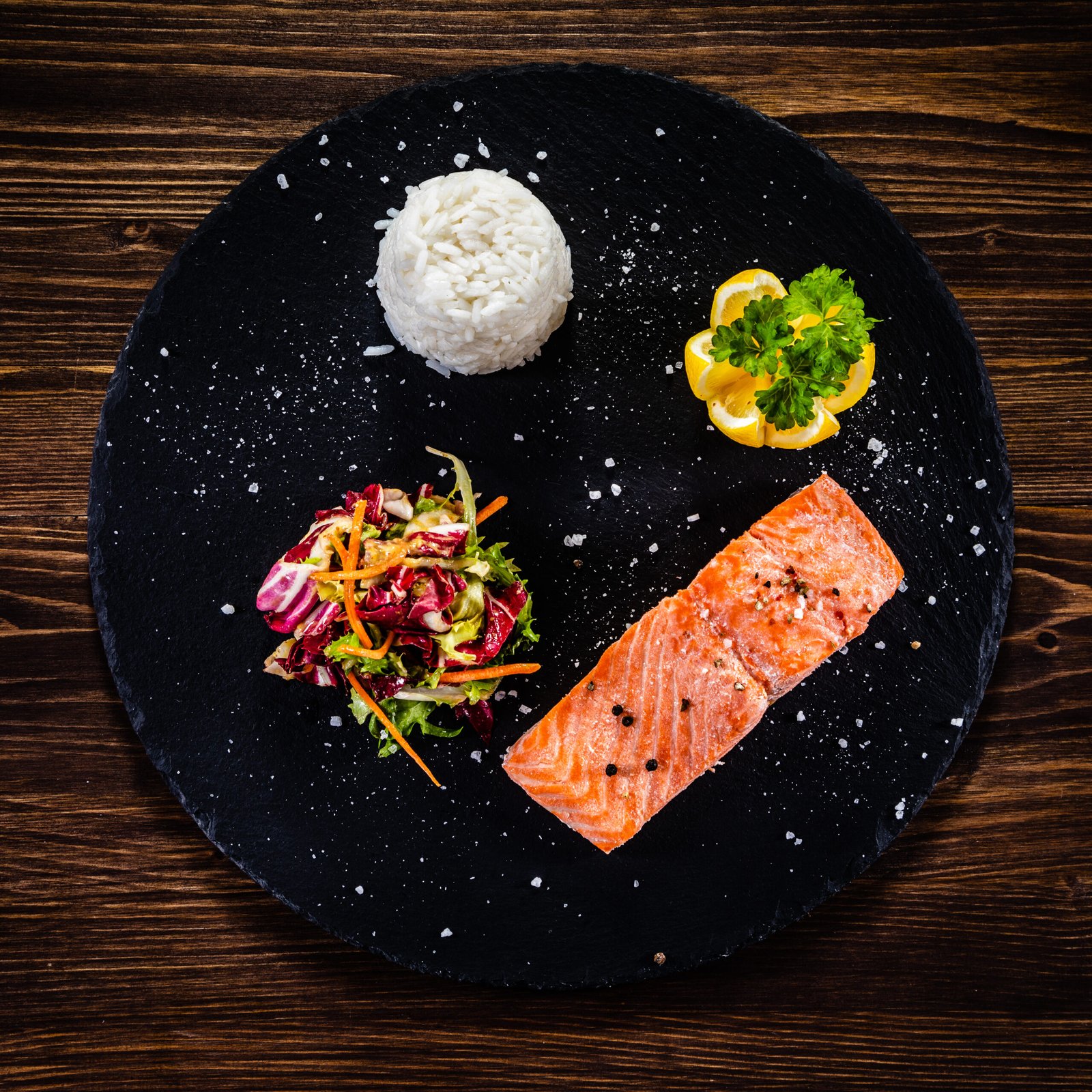 salmon steak with rice and salad on plate 2026 03 26 03 35 14 utc