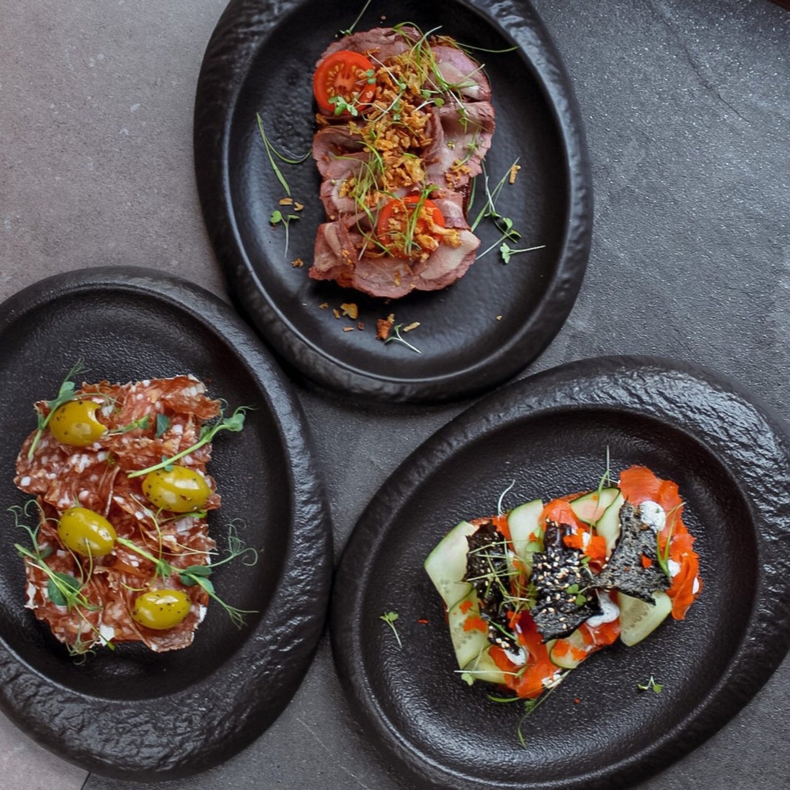 three appetizer plates with meat and vegetables 2026 01 06 09 43 02 utc
